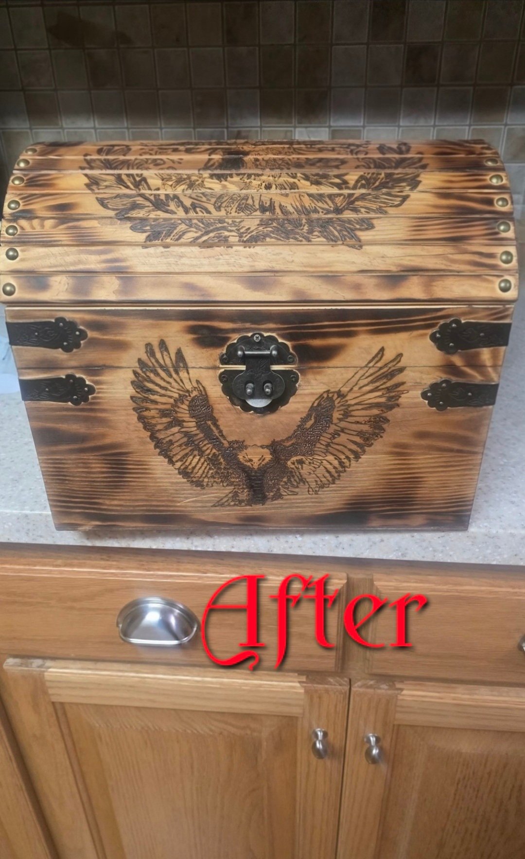Hand-burned wooden chest with eagle pyrography finished in Fireborn Goldflare wood finish showing a warm antique-gold glow.